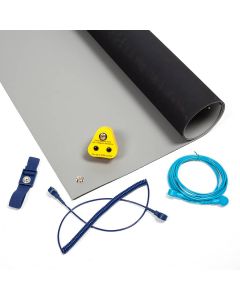 An ESD workstation kit with light grey ESD bench matting and the parts you need for a simple ESD setup.