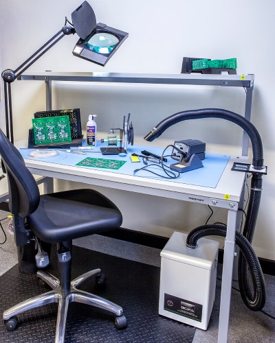 A production bench with BOFA V 200 system and pen-nib arm side bench mounted.